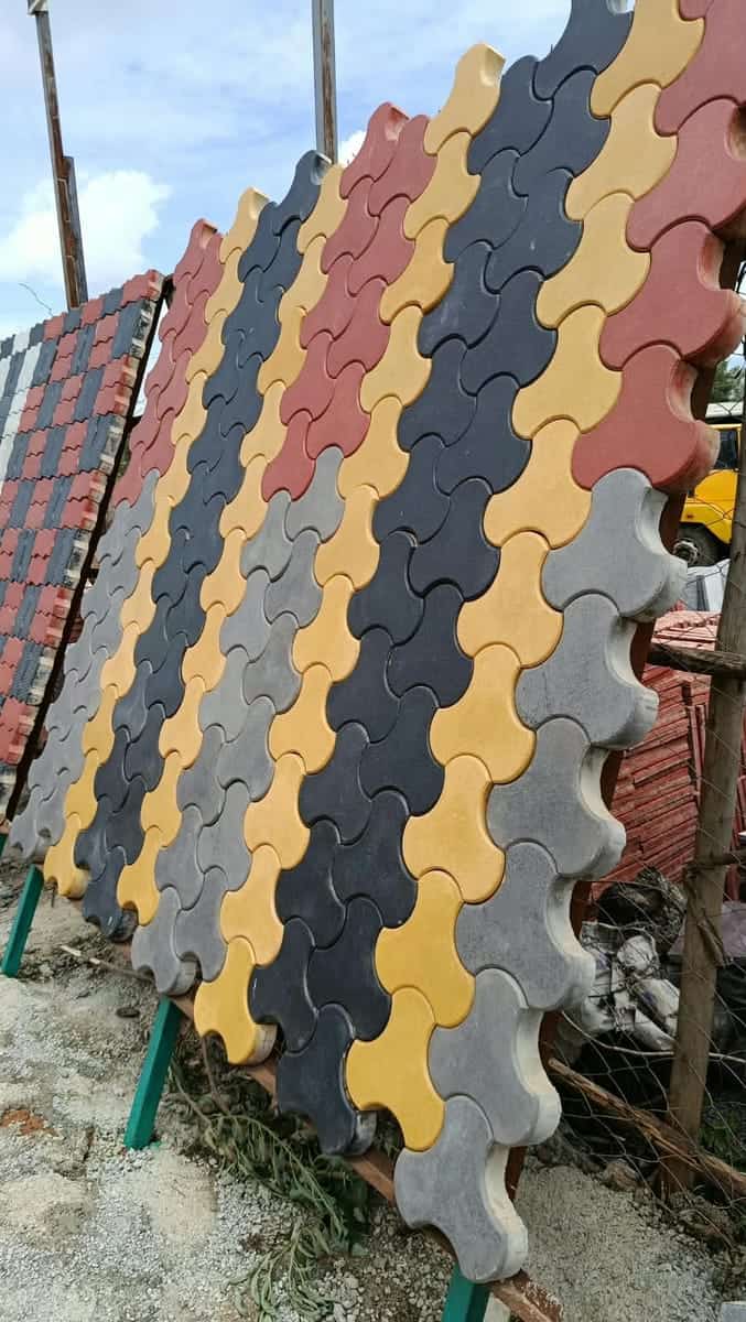 Dumbbell (damru) cabro blocks in yellow, charcoal, red and grey diagonal stripes on a yard display panel